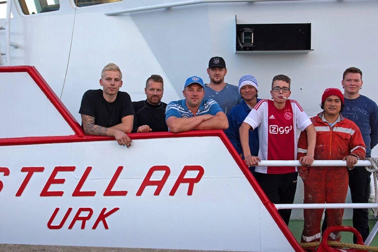 Proud crew aboard the extended UK-151 'Stellar'.